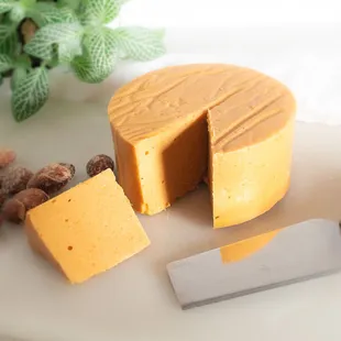 a piece of cheese and a knife