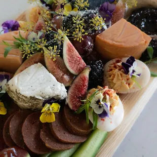 a platter of different types of cheese