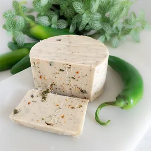 a block of cheese with a slice cut out of it