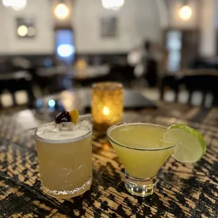 two cocktails on a table