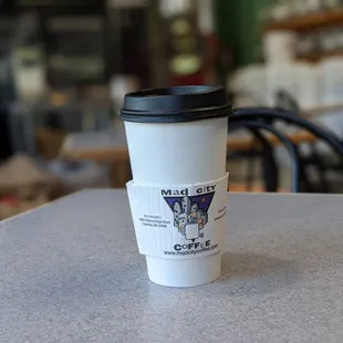 a cup of coffee on a table