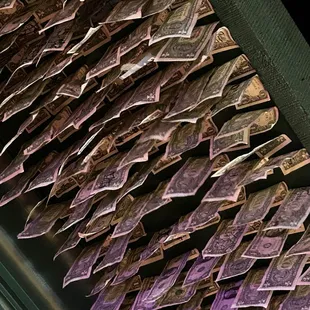 Dollar bills hang from the ceiling