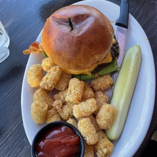 This was my hamburger a mad duck bacon avocado hamburger with tater tots delicious. One add 10 definitely attend will I order again yes