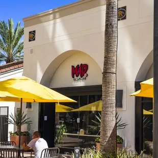 a restaurant with yellow umbrellas