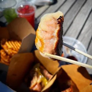 a piece of meat on a chopstick