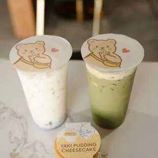 two cups of cheesecake and a cup of yogurt