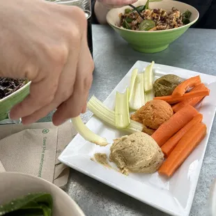 Hummus Trio with carrots &amp; celery sticks