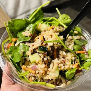 Greens and Grains bowl with grilled chicken, lemon juice, and veggies.