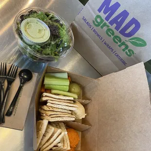 Salad dressing on the side and hummus trio