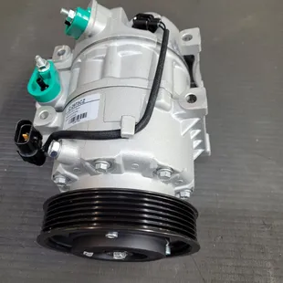 This is an A/C compressor. It's what makes your air conditioning system work.