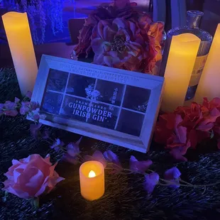 a table with candles and flowers