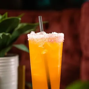 a tall glass of orange juice