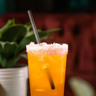 a tall glass of orange juice