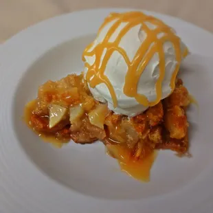 Apple cobbler with fresh whipped cream and housemade salted caramel.