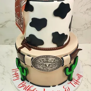 Two tiered cowboy theme cake. The top is banana and the bottom is red velvet. Both with crème cheese filling! Yum Yum