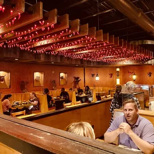a man and woman sitting in a restaurant