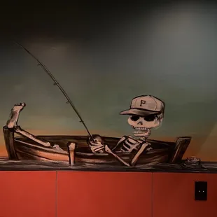 a skeleton in a boat