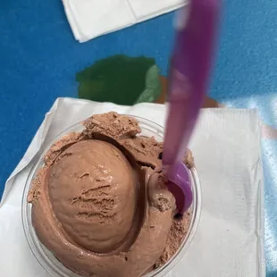 fudge brownie cup with a purple spoon