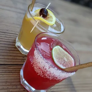 two cocktails on a wooden table