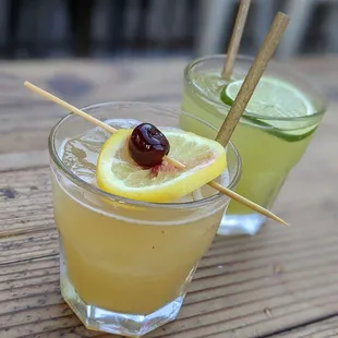 two cocktails on a wooden table
