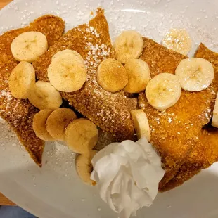 Crispy-Crunchy Cinnamon French Toast -  French Toast dipped in crispy corn flakes grilled to perfection, topped w bananas, sugar + cinnamon