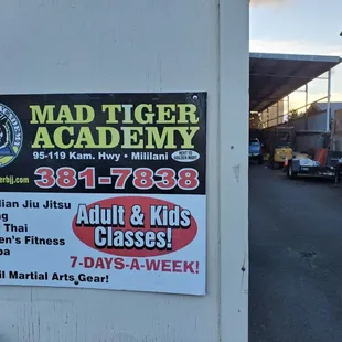 Contact info sign for Mad Tiger