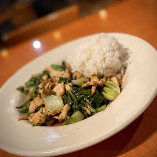  a plate of stir fried vegetables and rice