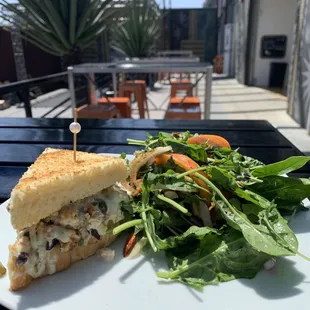 Tuna Melt - tuna salad with celery, capers, parsley, olives, jalapeño, and aioli on pan de mie.