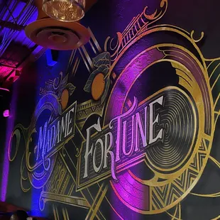 a neon sign on the wall of a restaurant