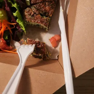 a piece of pizza and a salad
