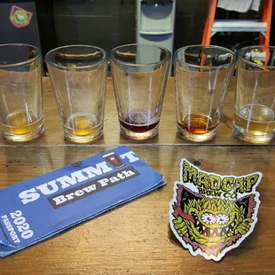 a row of glasses and a pint glass