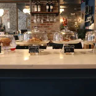 a counter with a variety of desserts