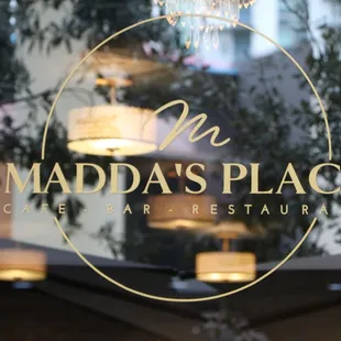 a reflection in the window of a restaurant