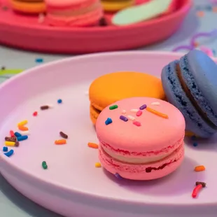three macarons on a plate