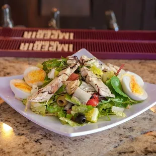 Mediterranean Salad- eggs, tomatoes, artichokes, olives, mozzarella