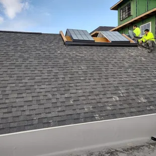 two men working on a roof