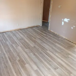 a room with a hard wood floor