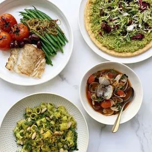 three plates of food on a table