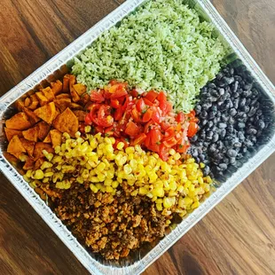 Healthy family dinners, delivered! Taco"bowls" serve 6-8. Cilantro rice, chili spiced sweet potatoes, coconut black beans, salsa fresca...
