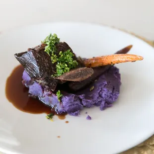 Plated entree, Braised Short Ribs over Okinawan Sweet Purple Potatoes