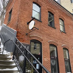 the entrance to a brick building