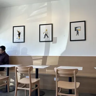 a man sitting at a table in a coffee shop