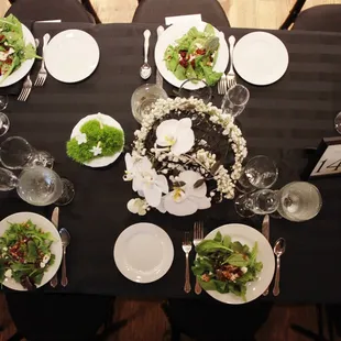 Plated Salads along a Tuscan seated table.