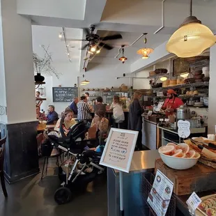 people sitting at tables in a restaurant