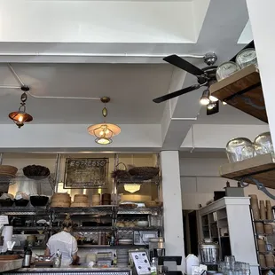 a kitchen with a ceiling fan