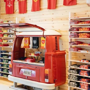 a red vw van parked in a store