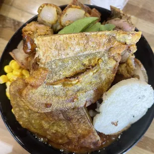 Rice, pork, chicken, beans, tostones and corn