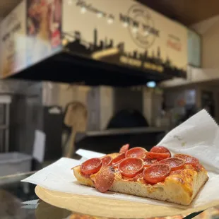 a slice of pepperoni pizza