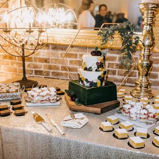 Dessert bar: brownies, s'more cupcakes, strawberry shortcake shooters, lemon bars and three tier wedding cake.