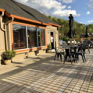 a patio with tables and chairs